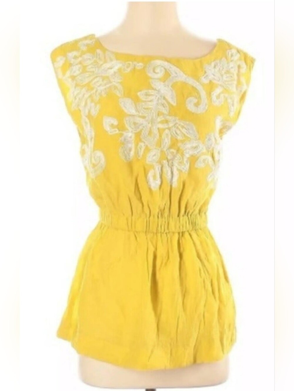 Dejavu mustard yellow sleeveless top features intricate white floral soutache